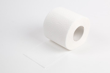 Roll of toilet paper on white background