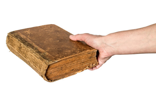 Hand Holding An Old Book  On White Background