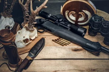 Fotobehang Retro hunting ammunition of rifle and binoculars. © Fxquadro