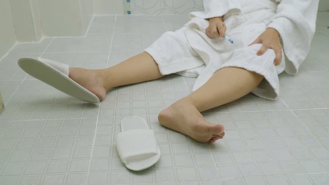 Woman falling in bathroom because slippery surfaces