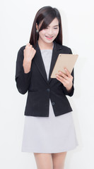 Naklejka premium Businesswoman use of mobile phone. young woman used smart phone. Hold hands glad concept success