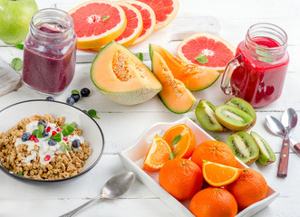 Breakfast with smoothies,  muesli and berries.