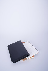 diary or open leather notebook on the background.