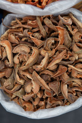 Heap of very dried apples in bag on fair.