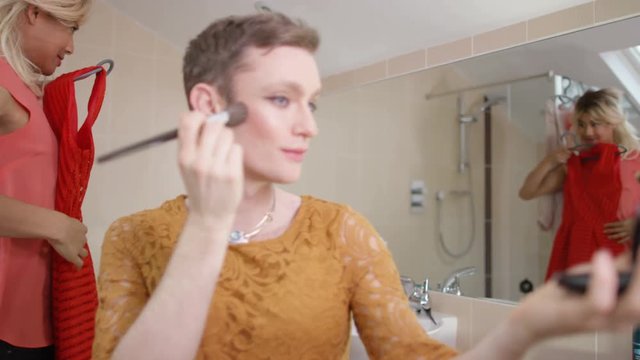  2 Transvestite men getting dressed as women & putting on make-up