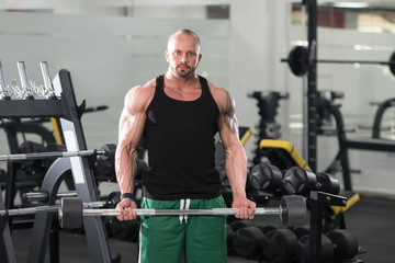 Fototapeta na wymiar Biceps Exercise With Barbell
