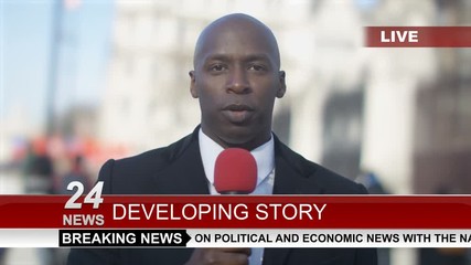  News reporter doing live piece to camera in busy city area