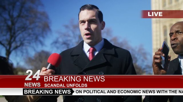  Man in business dress in London being bothered by news reporters