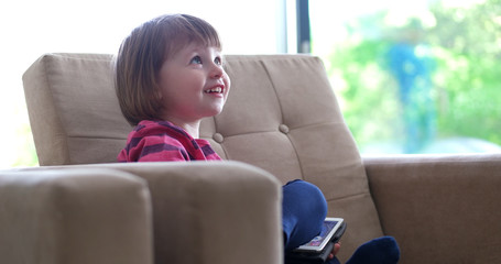 Child using tablet in modern apartment