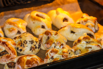 Buns on a baking sheet for Easter