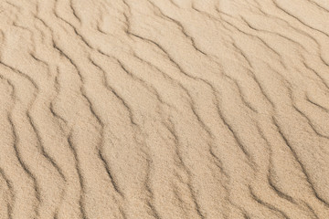 Waves in the sand, nature background.