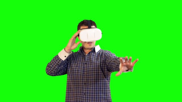 Greenscreen Virtual Reality Man in 360 Headset with Hands Out Reaction to Intense Video
