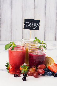 Bright summer smoothies in glass jars
