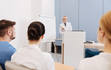 Obraz premium Qualified professor giving a lecture in the medical college
