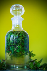 Mint syrup in a glass bottle