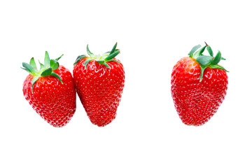 Three ripe red strawberry on a white background. Isolated