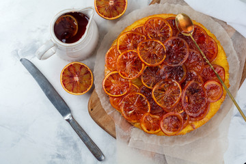 Candied red orange cake on a light background. Selective focus.Top view. Place for text.
