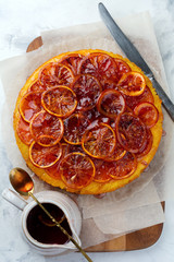 Candied red orange cake on a light background. Selective focus.Top view. Place for text.