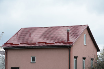 Metal roofing construction. Rain gutter and snow guard. Chimney coaxial. House with individual...