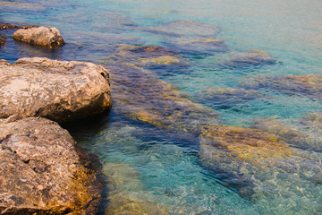 Beautiful seashore with breakwater and large stones