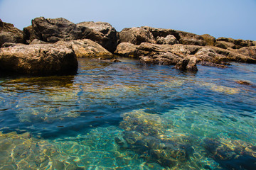 Beautiful seashore with breakwater and large stones