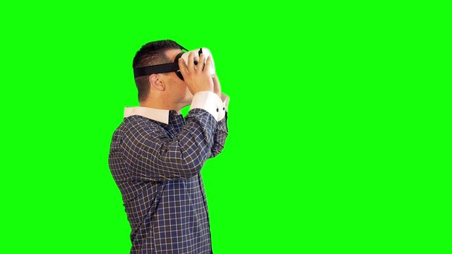 Greenscreen Virtual Reality Side View of Man Following Video Wearing 360 Headset