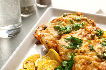 Tasty Italian chicken piccata with lemon on plate