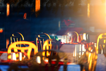 resort's restaurant is setting sun, evening, reflections on the wine glasses
