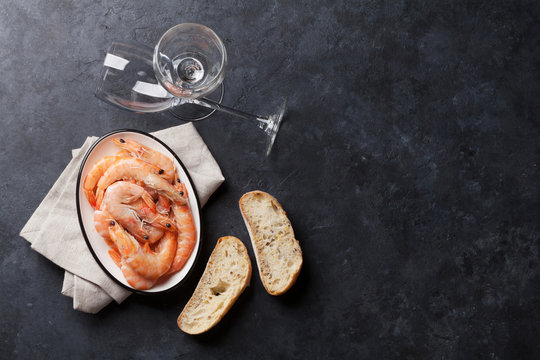 Fresh seafood on stone table. Shrimps
