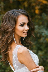 Beautiful young bride with long curly hair