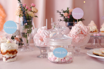 Candy bar. Table with different sweets for party