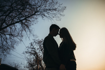 Amazing silhouette of lovers. True love emotions of joyful cute couple enjoying time together...