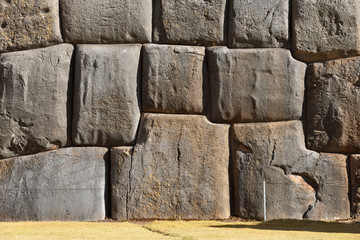 Inca wall in the village Saksaywaman Peru