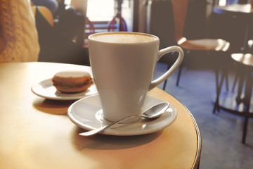 Cup of coffee on table in cafe