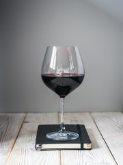Glass of wine on the book
