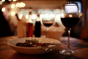 Serving a glass of red wine in a restaurant