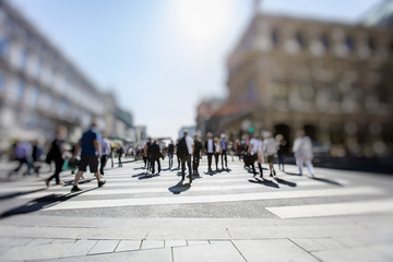 Obraz premium Busy Pedestrian Crossing over zebra on sunny day in the city