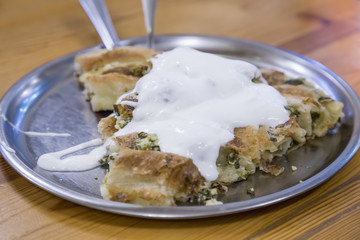 Bosnian rolled burek pie with cheese and spinach