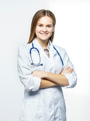Fototapeta premium portrait - a family doctor with stethoscope on white background