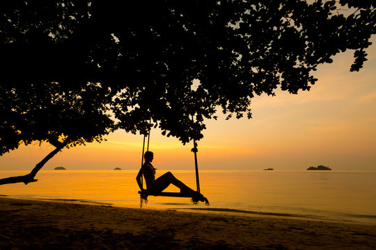 Beautiful woman on swing Thailand