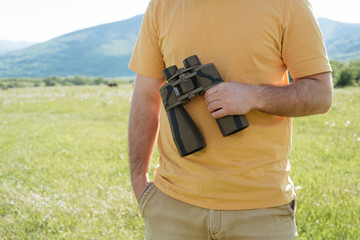 Man with binocular in hand