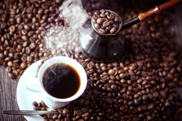 Strong coffee on the wooden background. Fresh coffee.