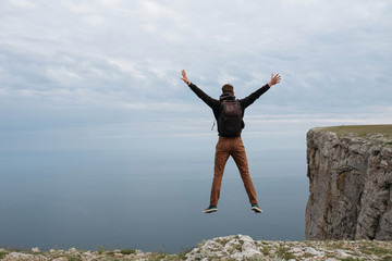 Man on top of mountain watch to the sea