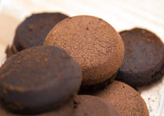 Fototapeta premium briquette used coffee grounds from espresso machine, component of soap making for texture and aroma effect