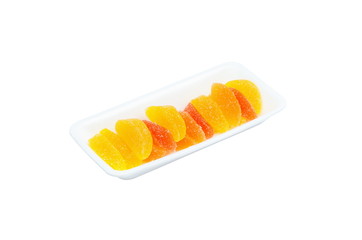 Bright multicolored marmalade on a tray, isolated on a white background