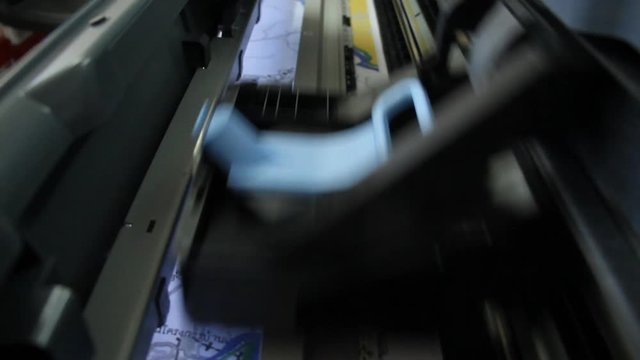 Large printer printing document paper with inkjet printer.