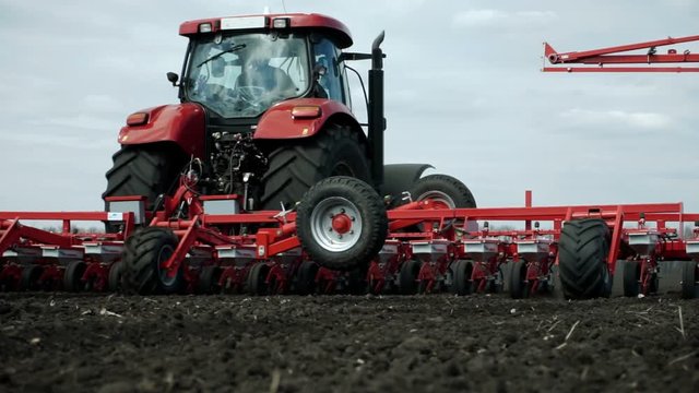 Spring sowing of sugar beet on a fertile land using modern agricultural machinery. HD