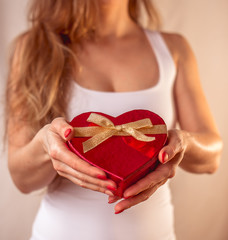 Red heart present woman hands holding - Valentine surprise