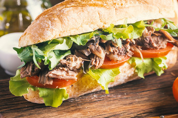 Beef sandwich with tomato and salad