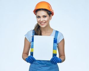 Builder holding white banner with copy space.